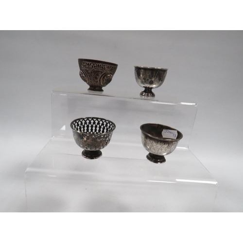 372 - THREE ANTIQUE OTTOMAN SILVER ZARF CUPS, ALONG WITH A TOMBAK EXAMPLE (4)