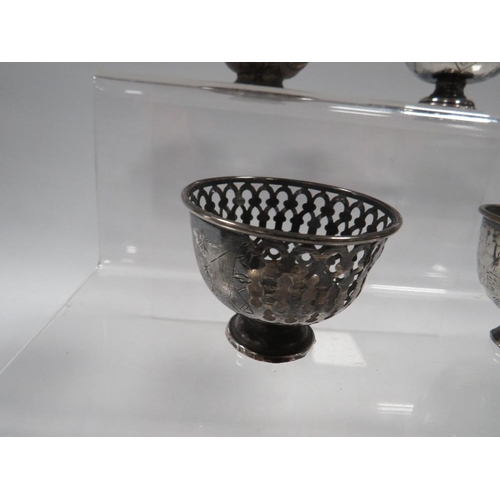 372 - THREE ANTIQUE OTTOMAN SILVER ZARF CUPS, ALONG WITH A TOMBAK EXAMPLE (4)