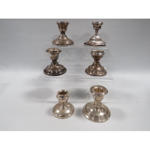 377 - SIX ASSORTED HALLMARKED SILVER SQUAT CANDLESTICKS VARIOUS DATES AND MAKERS A/F