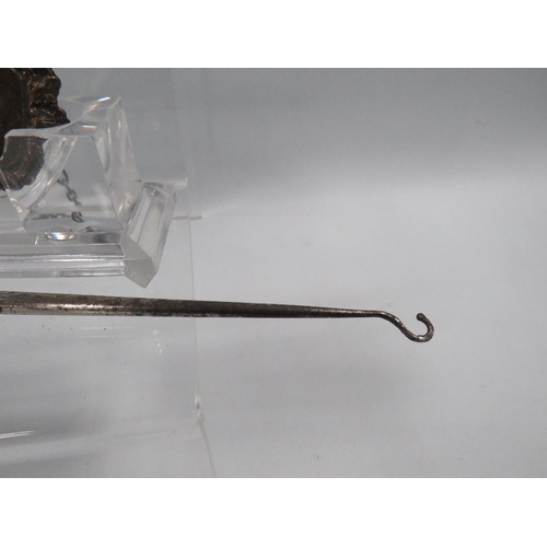 378 - A LARGE SILVER HANDLED BUTTON HOOK AND SILVER WINE LABEL