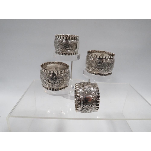 380 - FOUR HALLMARKED SILVER NAPKIN RINGS