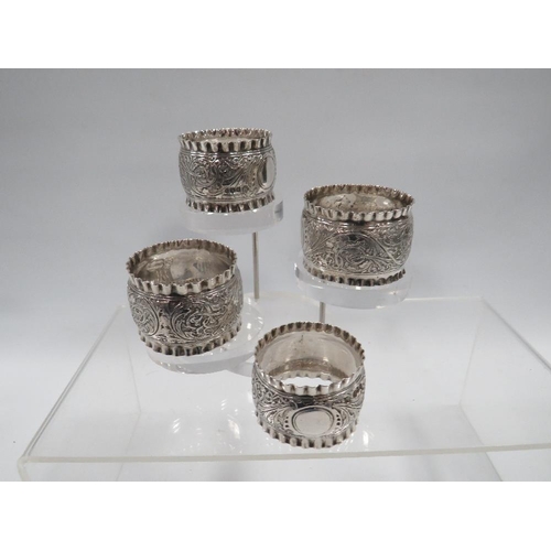 380 - FOUR HALLMARKED SILVER NAPKIN RINGS