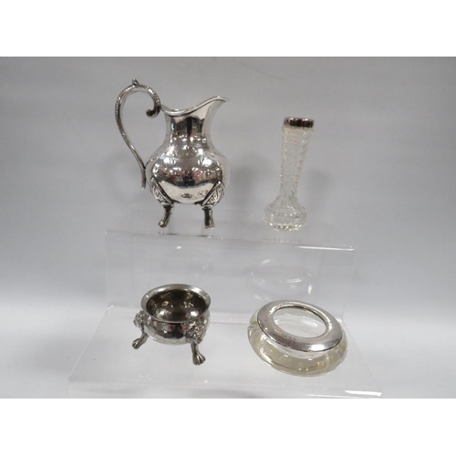 383 - A SMALL HALLMARKED SILVER RIMMED GLASS BUD VASE TOGETHER WITH A SILVER PLATED JUG ETC