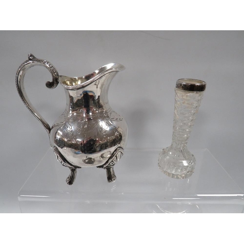 383 - A SMALL HALLMARKED SILVER RIMMED GLASS BUD VASE TOGETHER WITH A SILVER PLATED JUG ETC