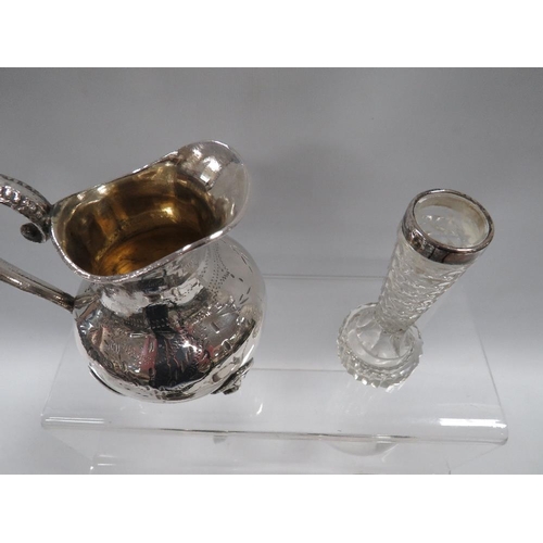 383 - A SMALL HALLMARKED SILVER RIMMED GLASS BUD VASE TOGETHER WITH A SILVER PLATED JUG ETC