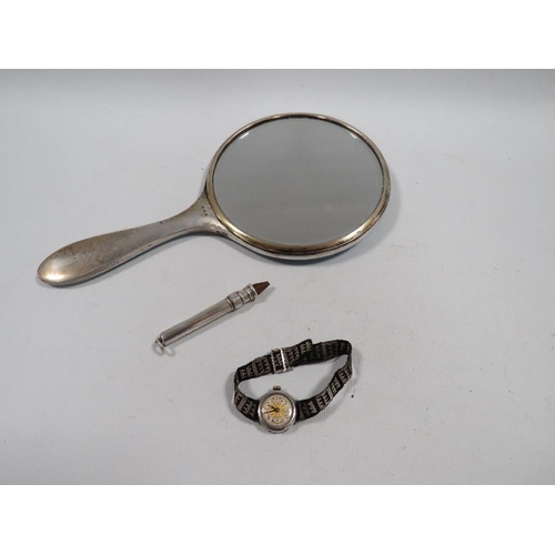 388 - THREE ITEMS OF HALLMARKED SILVER, TO INCLUDE AN ENAMEL HAND MIRROR A/F , WATCH AND A SLIDE ACTION PE... 