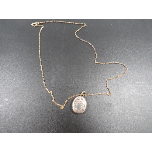 389 - A VICTORIAN LOCKET ON CHAIN