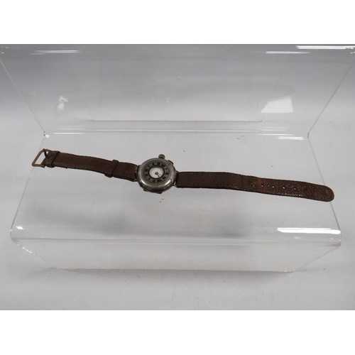 411 - AN ANTIQUE TRENCH WRISTWATCH WITH SILVER HUNTING STYLE CASE