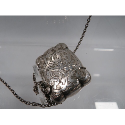 423 - AN ANTIQUE SILVER VESTA CASE ON SILVER CHAIN