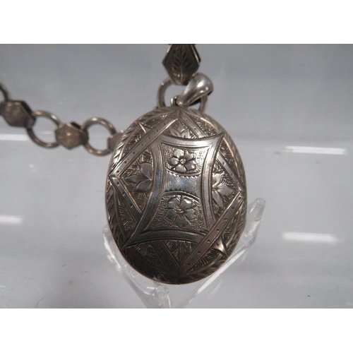 426 - AN ANTIQUE HALLMARKED SILVER COLLARETTE LOCKET