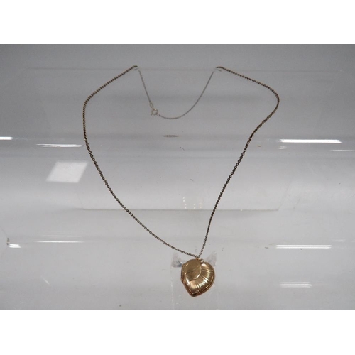 428 - AN LOCKET ON CHAIN MARKED 9CT GOLD BACK AND FRONT