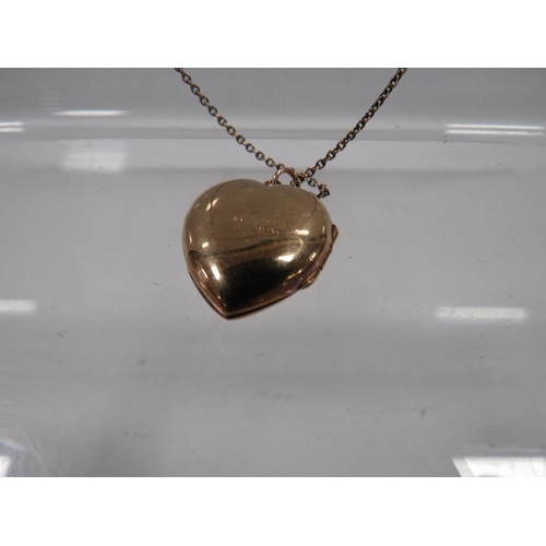 428 - AN LOCKET ON CHAIN MARKED 9CT GOLD BACK AND FRONT