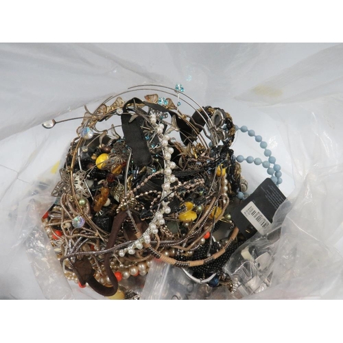 438 - A LARGE BAG OF MIXED COSTUME JEWELLERY BRACELETS, WATCHES ETC