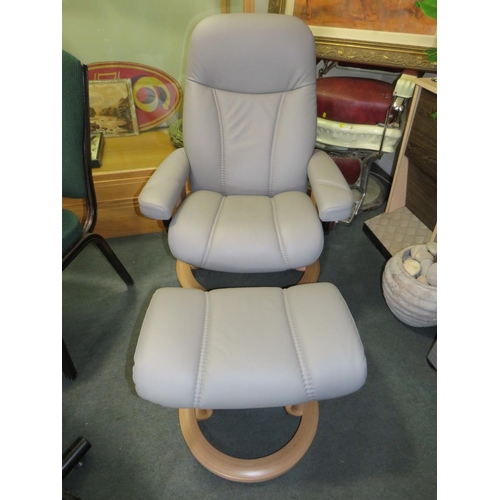 701 - AN EKORNES STRESSLESS ARMCHAIR & STOOL