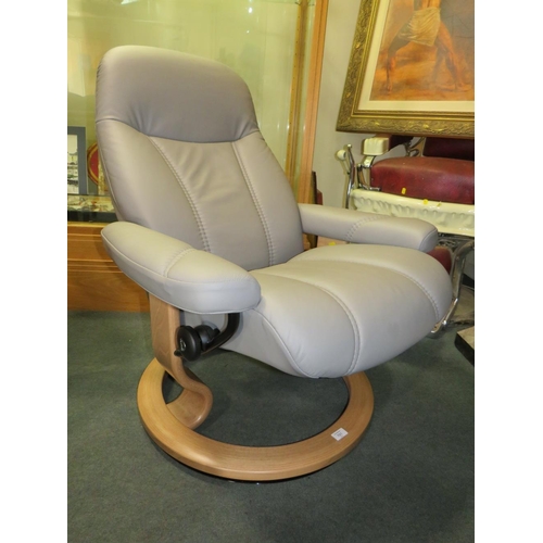 701 - AN EKORNES STRESSLESS ARMCHAIR & STOOL