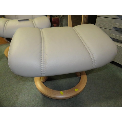 701 - AN EKORNES STRESSLESS ARMCHAIR & STOOL