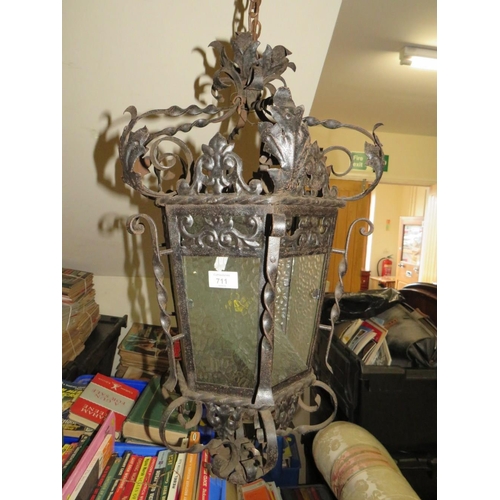 711 - A VINTAGE HANGING WROUGHT IRON LANTERN APPROX H-64 CM