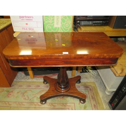 712 - A 19TH CENTURY MAHOGANY FOLD-OVER TEA TABLE ON QUATREFOIL BASE