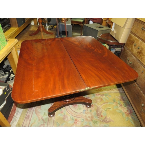 712 - A 19TH CENTURY MAHOGANY FOLD-OVER TEA TABLE ON QUATREFOIL BASE