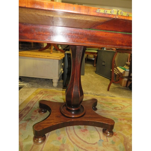 712 - A 19TH CENTURY MAHOGANY FOLD-OVER TEA TABLE ON QUATREFOIL BASE