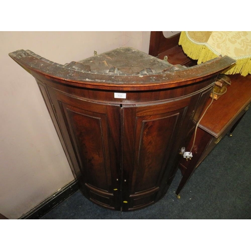 733 - AN ANTIQUE MAHOGANY BOW-FRONT HANGING CORNER CUPBOARD