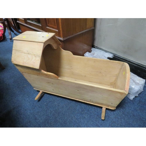 740 - AN ANTIQUE PINE ROCKING CRADLE / CRIB