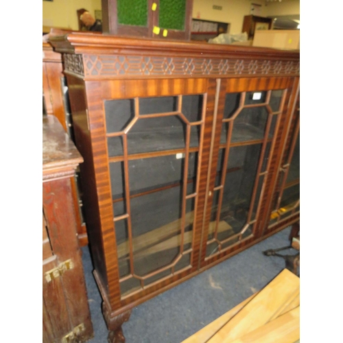 756 - A 20TH CENTURY MAHOGANY GLAZED THREE DOOR BOOKCASE ON BALL AND CLAW FEET 126 X 145 CM