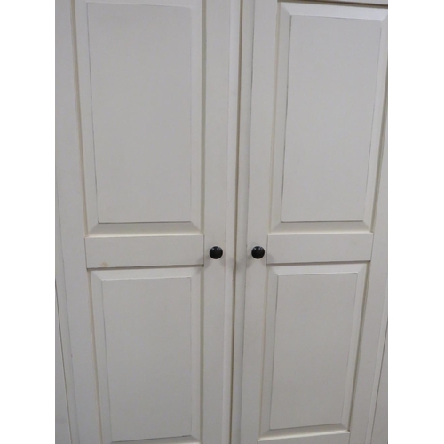 762 - A MODERN CREAM AND OAK DOUBLE WARDROBE WITH DRAWER