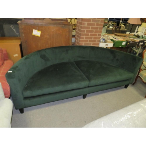 768 - A LARGE MODERN CURVED GREEN SOFA