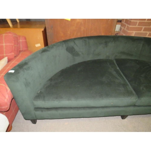 768 - A LARGE MODERN CURVED GREEN SOFA