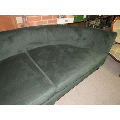 768 - A LARGE MODERN CURVED GREEN SOFA