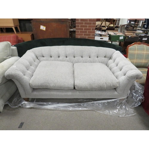 769 - A MODERN UPHOLSTERED BUTTON-BACK SOFA