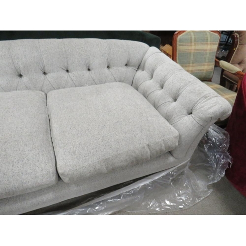 769 - A MODERN UPHOLSTERED BUTTON-BACK SOFA