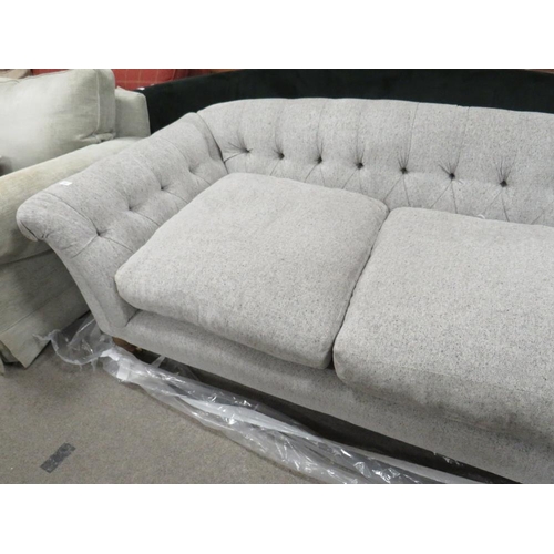 769 - A MODERN UPHOLSTERED BUTTON-BACK SOFA