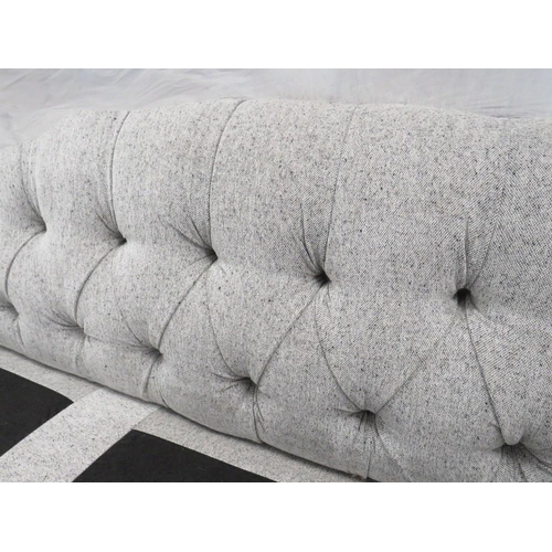 769 - A MODERN UPHOLSTERED BUTTON-BACK SOFA