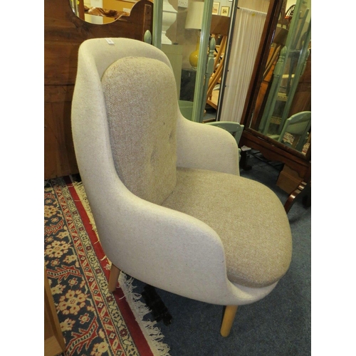 780 - A MODERN UPHOLSTERED ARMCHAIR