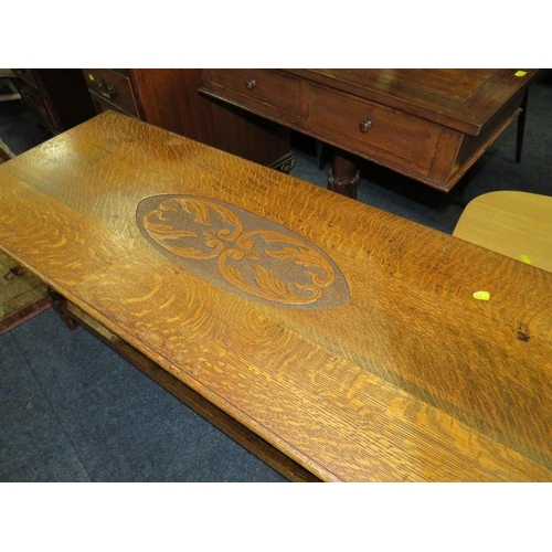 802 - AN OAK CARVED COFFEE TABLE