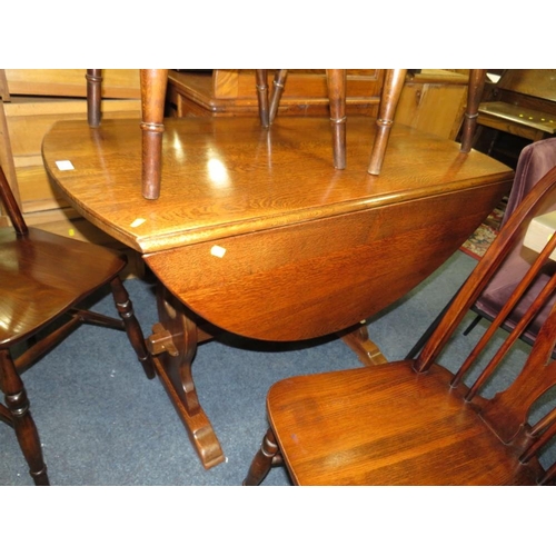 828 - AN OAK DROPLEAF TABLE AND FIVE HOOP BACK CHAIRS