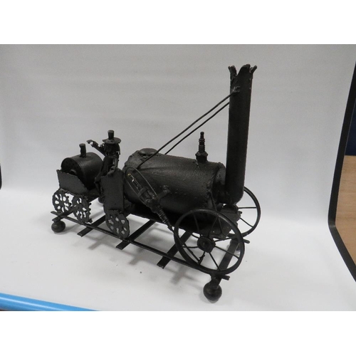 94 - A METAL FOLK ART MODEL OF 'THE ROCKET' LOCOMOTIVE