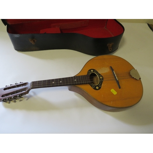 280 - A CASED 8 STRING MANDOLIN STYLE INSTRUMENT