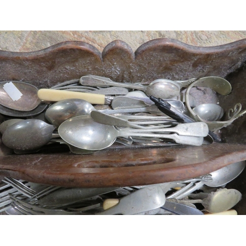 306 - A TREEN HANDLED CUTLERY TRAY AND CONTENTS