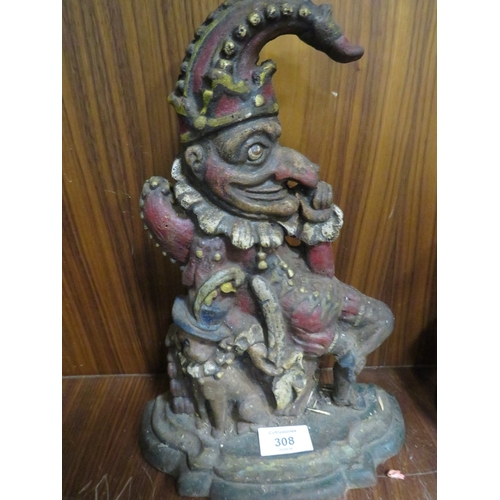 308 - AN ANTIQUE CAST IRON DOOR STOP IN THE FORM OF MR PUNCH