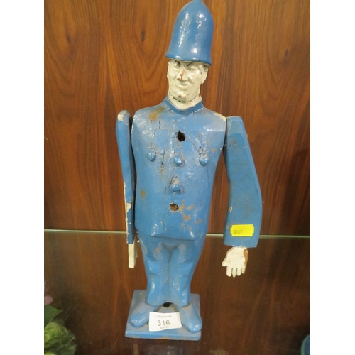 316 - AN UNUSUAL WOODEN FIGURE OF A POLICEMAN