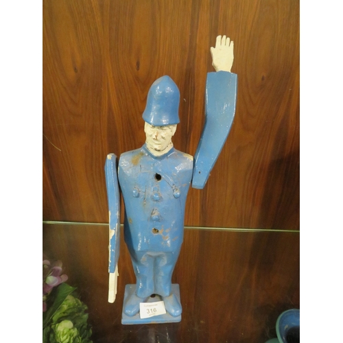 316 - AN UNUSUAL WOODEN FIGURE OF A POLICEMAN