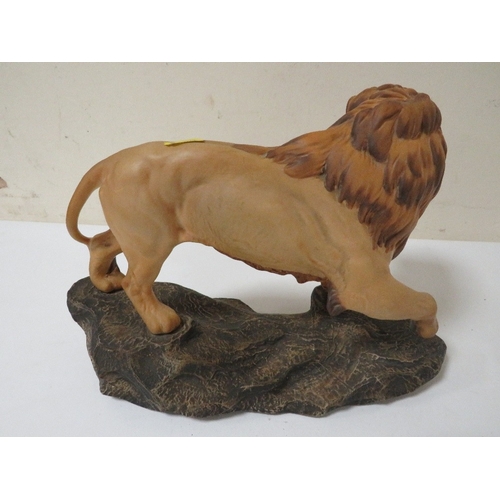 321 - A BESWICK LION ON A ROCK