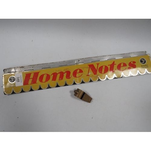 348 - AN ADVERTISING HOME NOTES LETTER BOX STYLE COVER TOGETHER WITH AN ACME THUNDERER WHISTLE