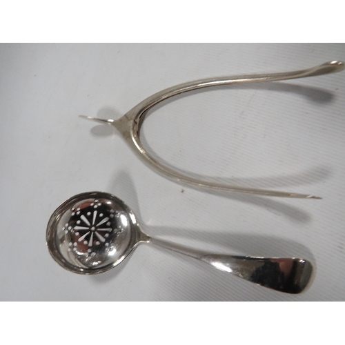 380A - A PAIR OF HALLMARKED SILVER WISHBONE SUGAR TONGS TOGETHER WITH A HALLMARKED SILVER SIFTER SPOON (2)