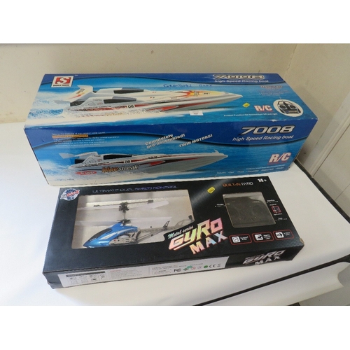 327 - A BOXED RADIO CONTROL HIGH SPEED RACING BOAT PLUS A BOXED RADIO CONTROLLED HELICOPTER (2)