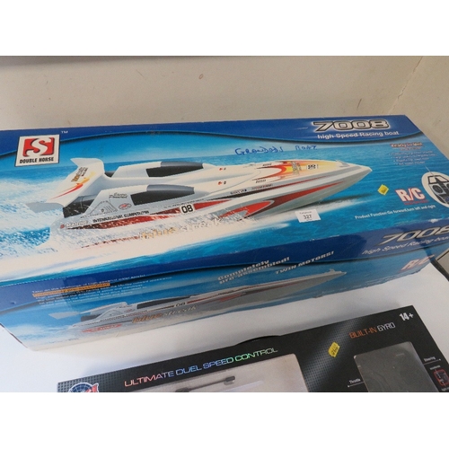 327 - A BOXED RADIO CONTROL HIGH SPEED RACING BOAT PLUS A BOXED RADIO CONTROLLED HELICOPTER (2)