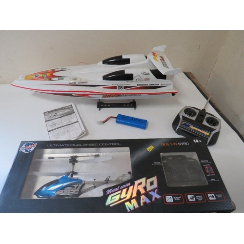 327 - A BOXED RADIO CONTROL HIGH SPEED RACING BOAT PLUS A BOXED RADIO CONTROLLED HELICOPTER (2)